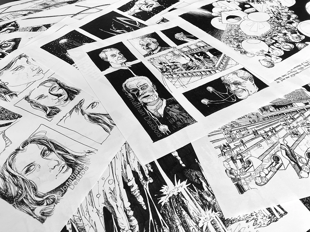 Photographie de planches destinées à une exposition de dessins.